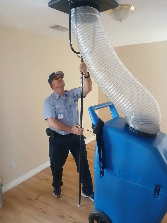 Furnace Tune-Up technician using HEPA equipment in Westwood